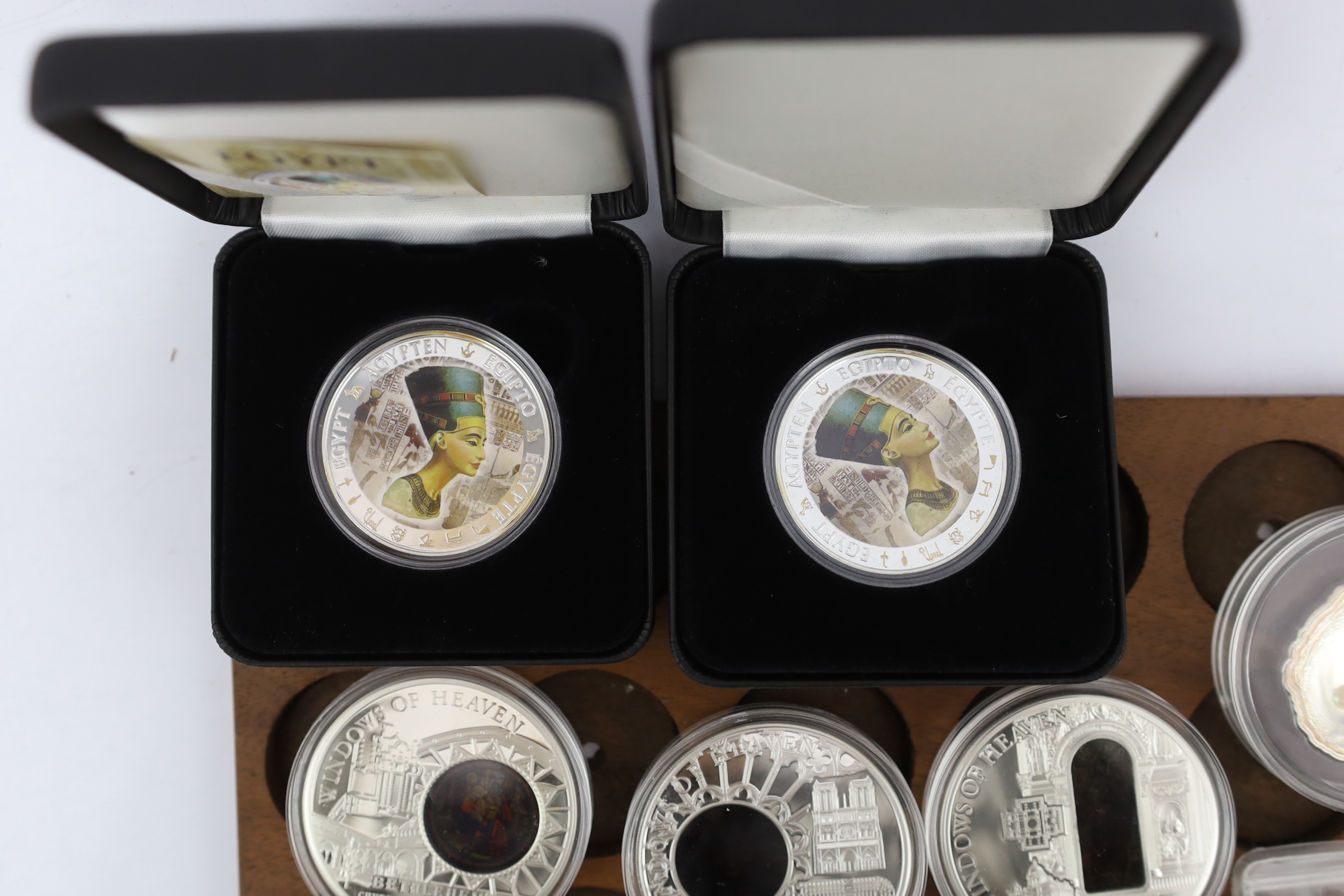 Elizabeth II Cook Islands silver proof commemorative coins, six windows of heaven $10, a Christmas 2009 $5, Republic of Palau shells of the sea 2011 $5 ‘pearl oyster’, Sacred Art Holy Windows 2011 $10, two Fiji Nefertiti